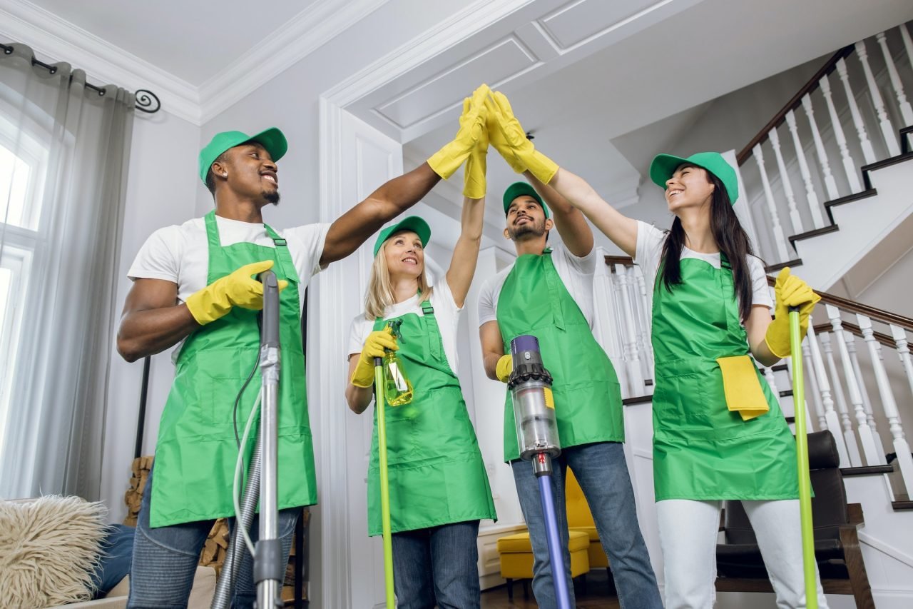 Grand Max cleaning team celebrating after a job